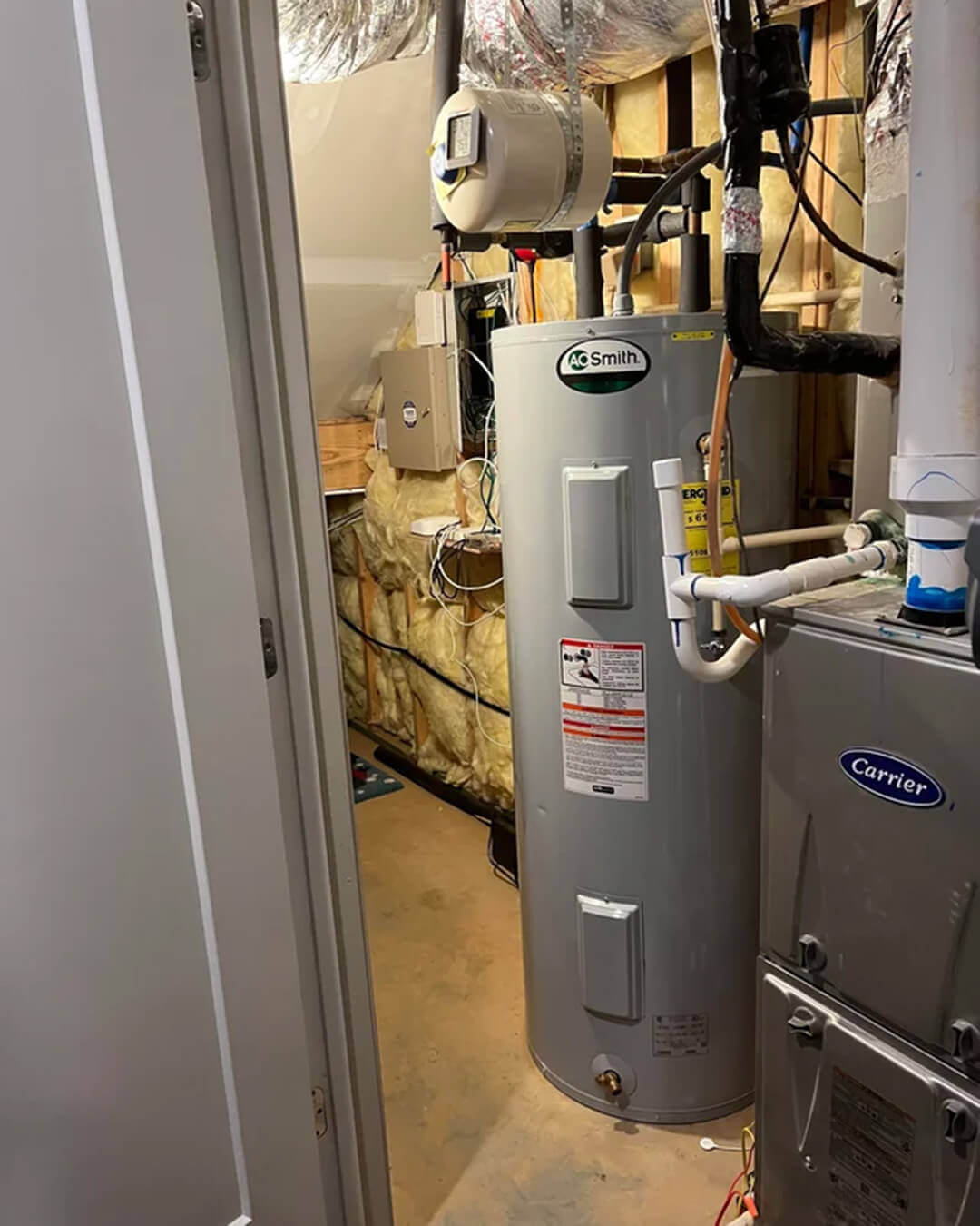 Replacing Gas Water Heaters in Edmonton New gas hot water heater installed in a mechanical room of an Edmonton home.
