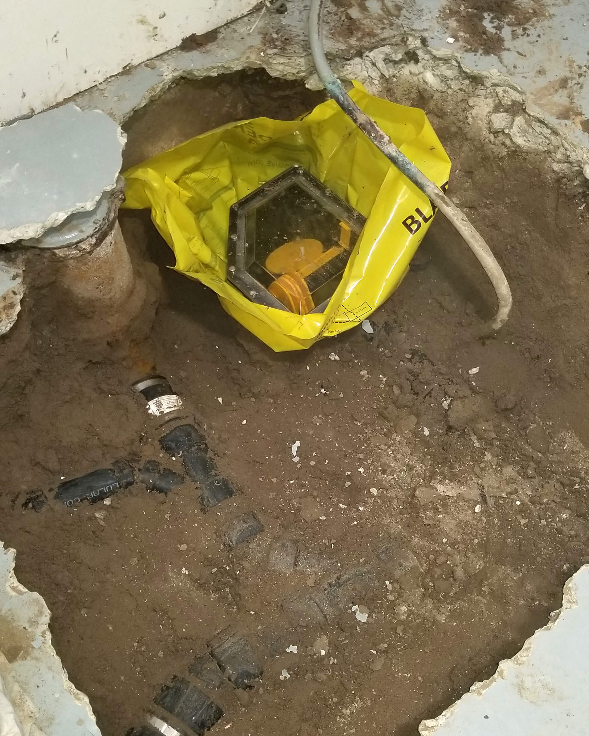 Successful Backwater Valve Installation in St. Albert Basement floor in St. Albert with a newly installed backwater valve, ensuring reliable flood protection.