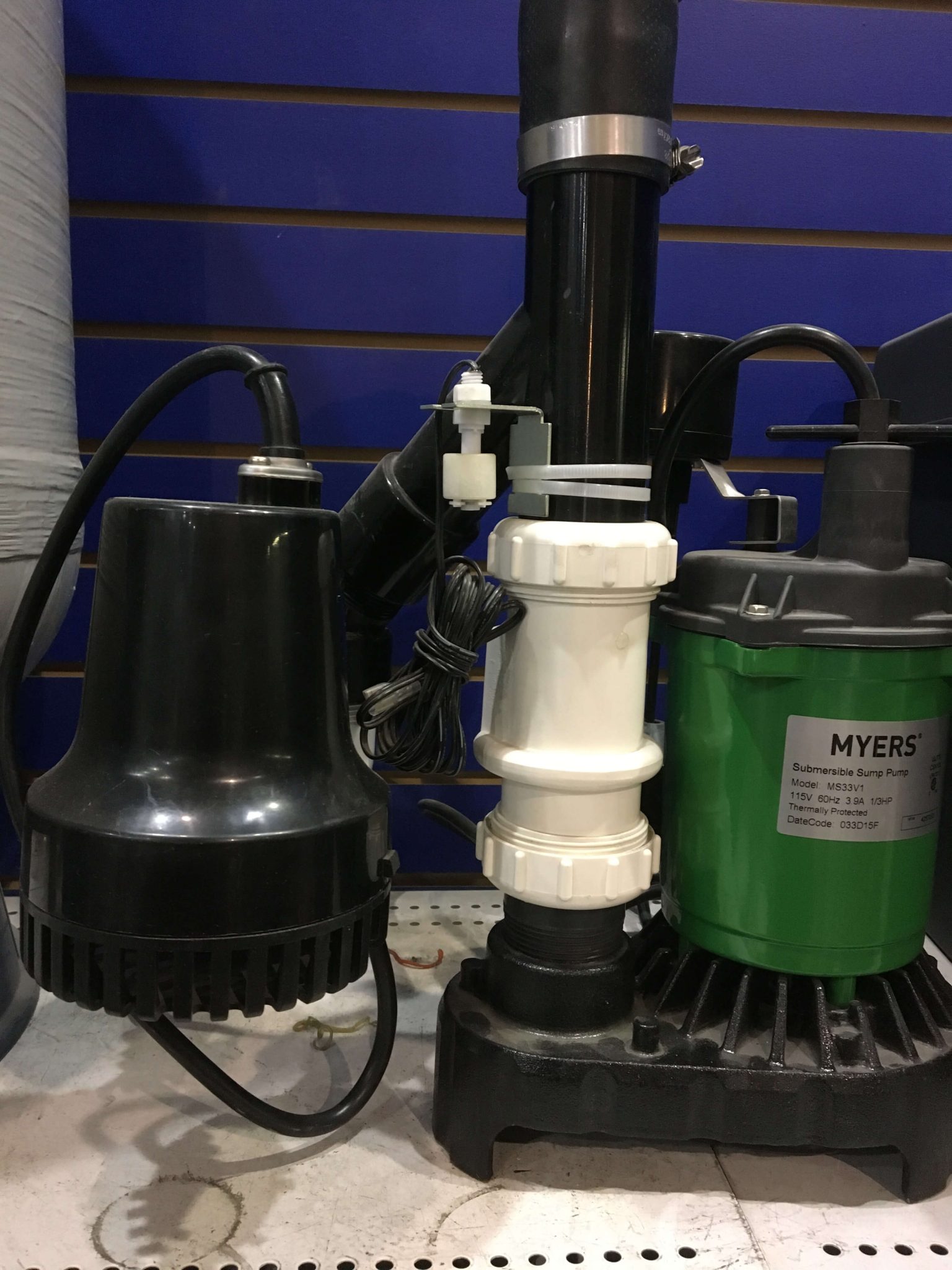 New backup sump pump system setup in an Calgary home, enhancing flood protection.