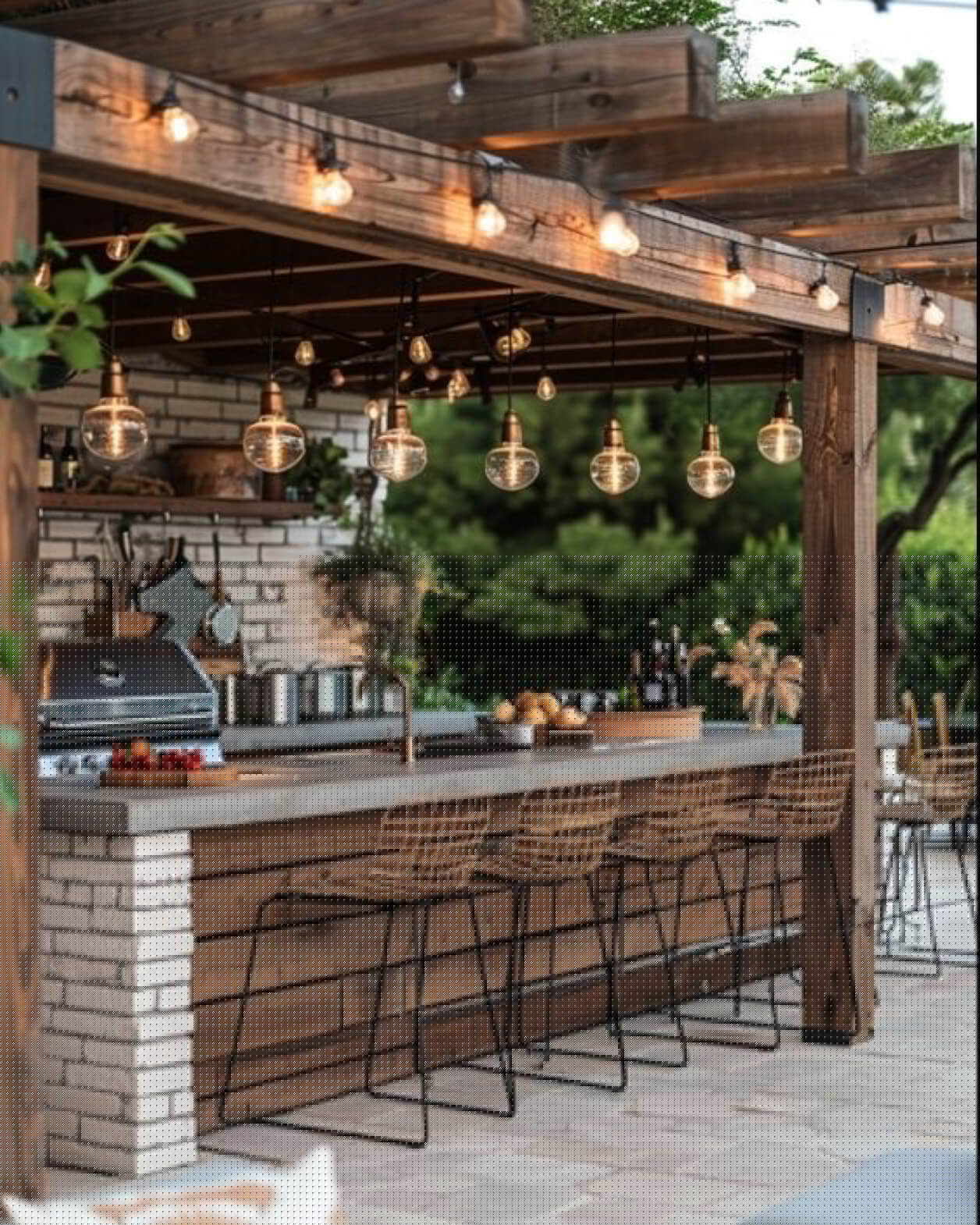 Chic and functional outdoor kitchen design in Canmore, tailored for stylish outdoor dining experiences.