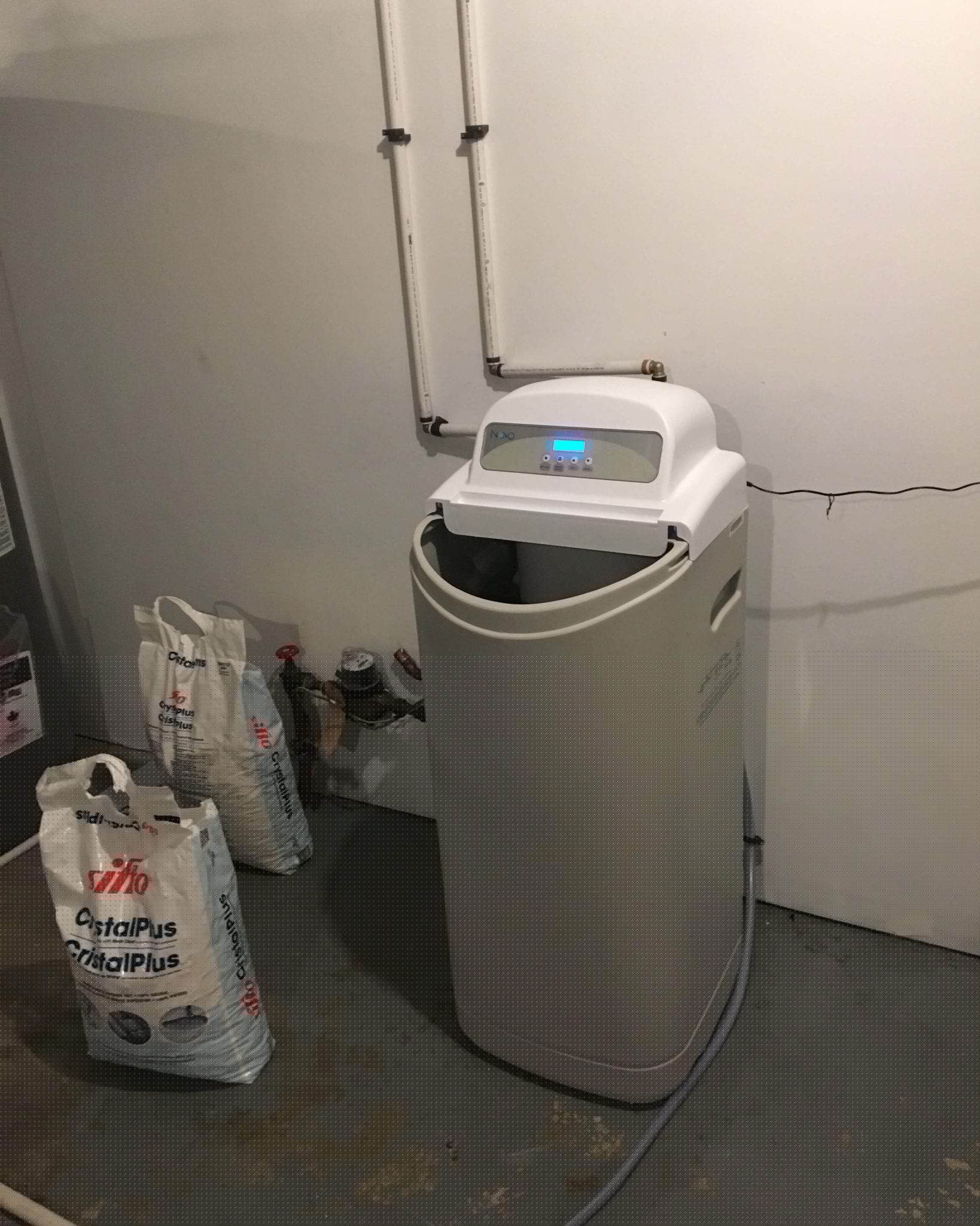 Commissioning New Water Softeners in Canmore Technician in Canmore commissioning a new water softener to guarantee optimal performance.