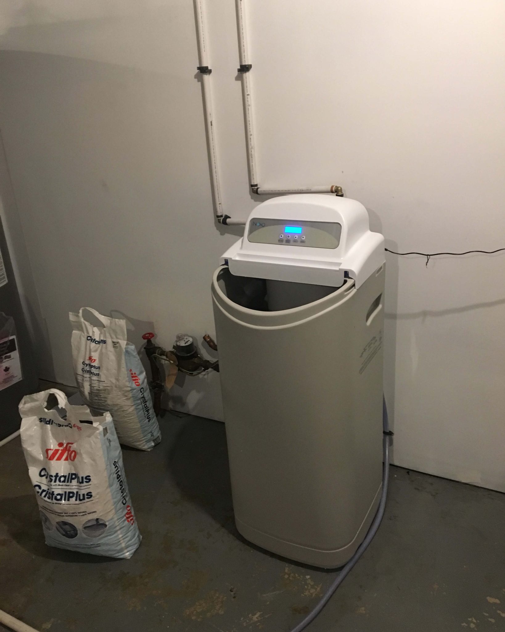Commissioning New Water Softeners in St. Albert Technician in St. Albert commissioning a new water softener to guarantee optimal performance.