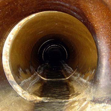 Kingstree Plumbing offers thorough Sewer Line Inspection services in Strathcona County. Picture a Kingstree Plumbing technician using a specialized camera system to examine the interior of a sewer line at a property in Strathcona County. The image might show a monitor displaying the video feed from inside the pipe, revealing any blockages or damage.