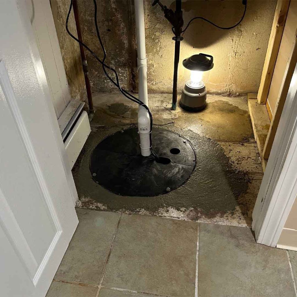Installed sump pit with discharge line exiting the top in Sherwood Park home